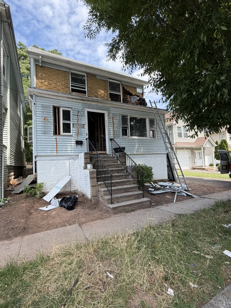 Roselle home exterior before renovation