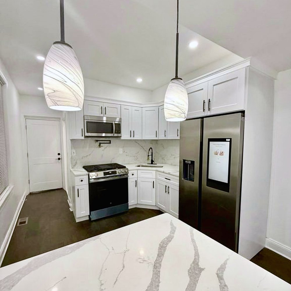 Renovated kitchen with stone island